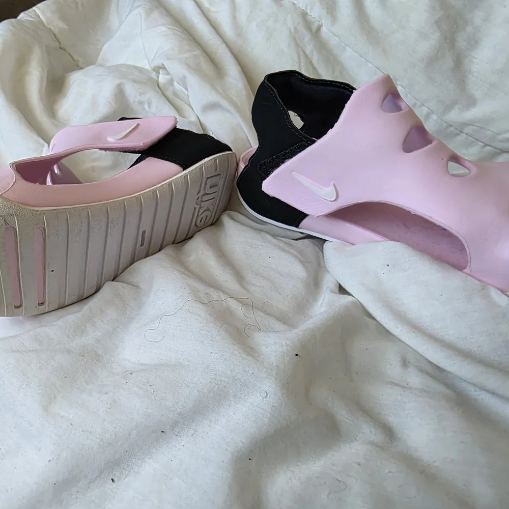 Nike Pink Foam Slip-On Sandals